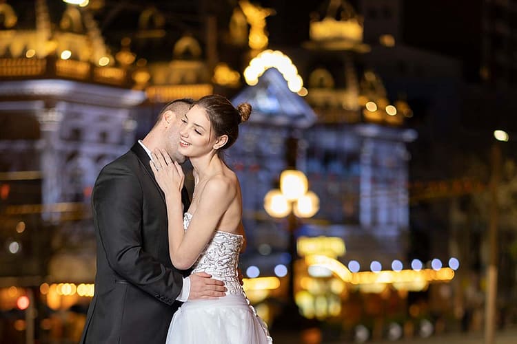 beautiful night portrait of bride and groom with Princess theatre in the background