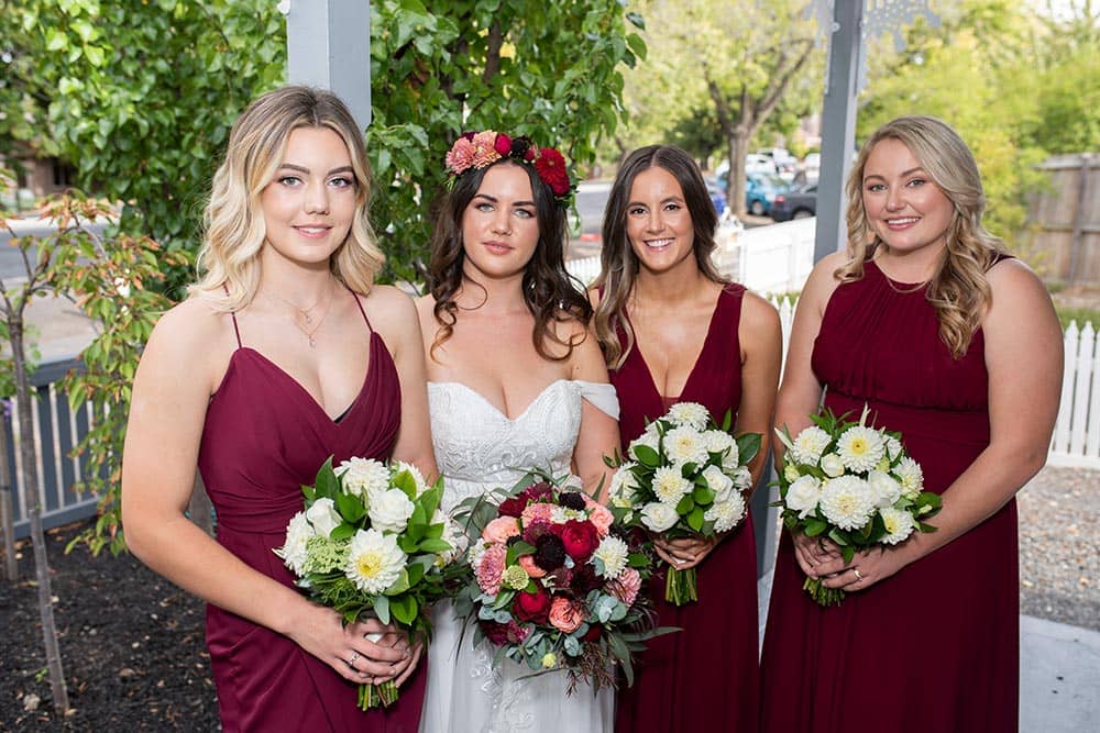 bride and bridesmaid holding flowers